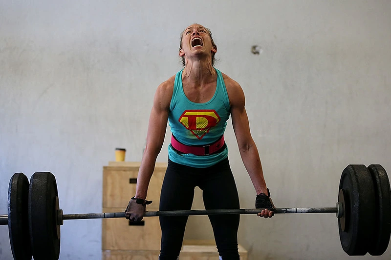 SAN ANSELMO, CA - MARCH 14: A class participant does a deadlift during a CrossFit workout at Ross Valley CrossFit on March 14, 2014 in San Anselmo, California. CrossFit, a high intensity workout regimen that is a constantly varied mix of aerobic exercise, gymnastics and Olympic weight lifting, is one of the fastest growing fitness programs in the world. The grueling cult-like core strength and conditioning program is popular with firefighters, police officers, members of the military and professional athletes. Since its inception in 2000, the number of CrossFit affiliates, or "boxes" has skyrocketed to over 8,500 worldwide with more opening every year. (Photo by Justin Sullivan/Getty Images)