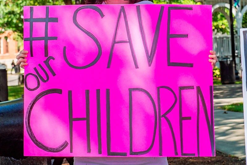 US-CRIME-CHILDREN-PROTEST
Demonstrators in Keene, New Hampshire, gather at a "Save the Children Rally" to protest child sex trafficking and pedophilia around the world, on September 19, 2020. - Anti-paedophilia protests are flaring in th US where the QAnon movement started. QAnon is the umbrella term for a sprawling set of internet conspiracy theories that allege that the world is run by a cabal of Satan-worshiping pedophiles who are plotting against US President Donald Trump while operating a global child sex-trafficking ring. (Photo by Joseph Prezioso / AFP) (Photo by JOSEPH PREZIOSO/AFP via Getty Images)
