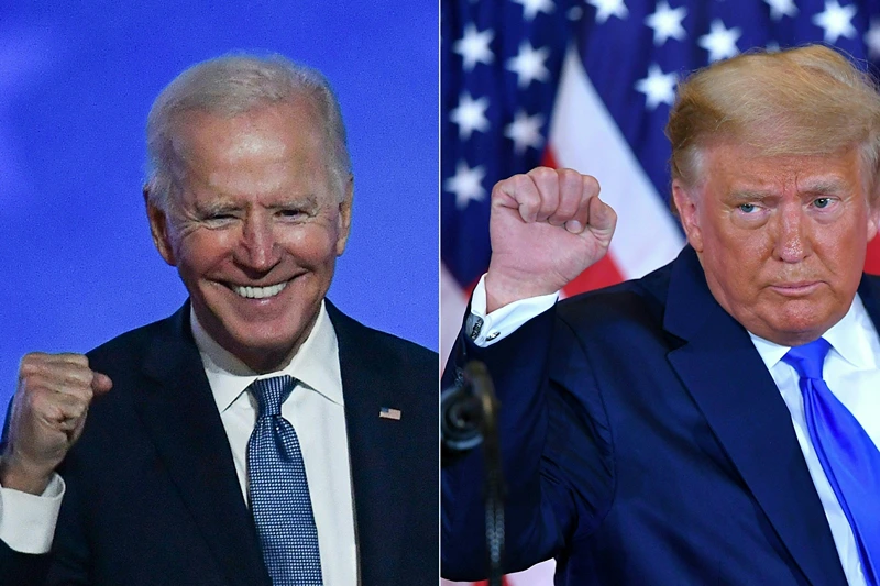 TOPSHOT-COMBO-US-VOTE-TRUMP-BIDEN
TOPSHOT - (COMBO) This combination of pictures created on November 04, 2020 shows Democratic presidential nominee Joe Biden (L) in Wilmington, Delaware, and US President Donald Trump (R) in Washington, DC both pumping their fist during an election night speech early November 4, 2020. President Donald Trump and Democratic challenger Joe Biden are battling it out for the White House, with polls closed across the United States -- and the American people waiting for results in key battlegrounds still up for grabs, one day after the US presidential election November 03. (Photo by ANGELA WEISS and MANDEL NGAN / AFP) (Photo by ANGELA WEISS,MANDEL NGAN/AFP via Getty Images)