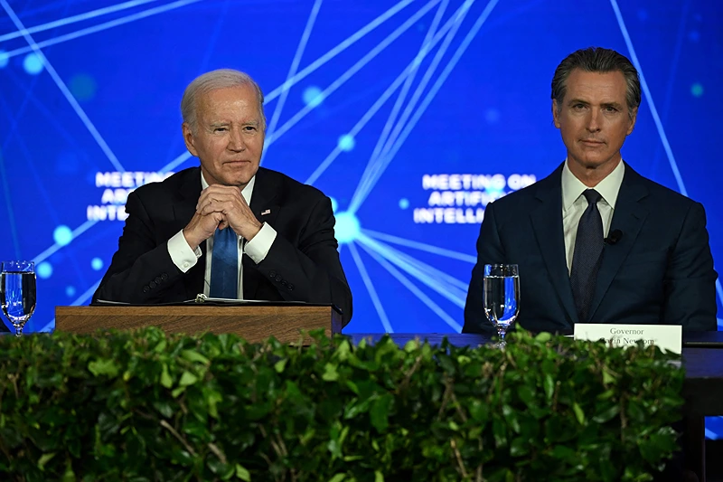 US-POLITICS-BIDEN-AI
US President Joe Biden (L) and California Governor Gavin Newsom takes part in an event discussing the opportunities and risks of Artificial Intelligence at the Fairmont Hotel in San Francisco, California, on June 20, 2023. (Photo by ANDREW CABALLERO-REYNOLDS / AFP) (Photo by ANDREW CABALLERO-REYNOLDS/AFP via Getty Images)