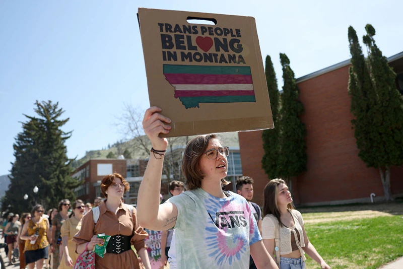 MISSOULA, MONTANA - MAY 03: Transgender rights activists hold signs as they march through the University of Montana campus on May 03, 2023 in Missoula, Montana. Dozens of students and transgender rights activists staged a demonstration on the University of Montana campus to protest the censure of transgender Montana state Rep. Zooey Zephyr by House Republicans in the Montana State Legislature for breaking House rules of decorum by saying state legislators would have "blood on your hands" if a transgender youth care ban was passed. (Photo by Justin Sullivan/Getty Images)