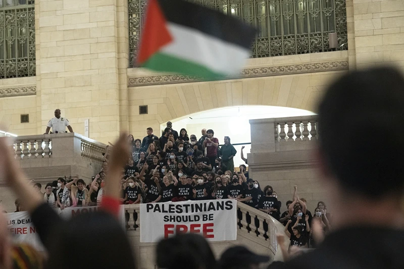 Protesters gather at Grand Central Terminal during a rally calling for a ceasefire between Israel and Hamas on Friday, Oct. 27, 2023, in New York.
(AP Photo/Jeenah Moon)