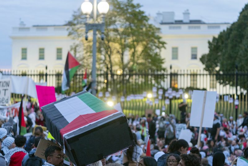 Anti-war activists carrying a mock coffin protest outside of the White House during a pro-Palestinian demonstration asking for a cease fire in Gaza in Washington, Saturday, Nov. 4, 2023. (AP Photo/Jose Luis Magana)