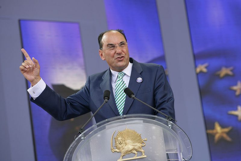 Alejo Vidal Quadras, Vice-President of the European Parliament, gestures as he gives a speech prior to the arrival of Iranian opposition group People's Mujahedeen's leader in exile, Maryam Radjavi (unseen) during a rally organized by the National Council of Resistance of Iran on June 26, 2010 in Taverny, outside Paris. Iranians call for a tougher policy in Iran. AFP PHOTO / ALEXANDER KLEIN (Photo credit should read ALEXANDER KLEIN/AFP via Getty Images)