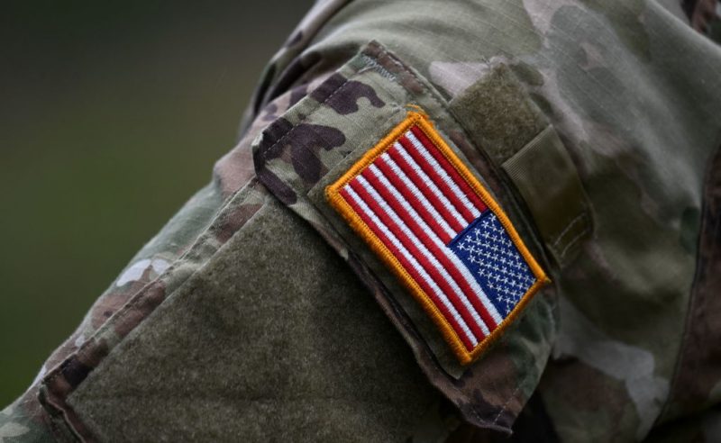 A soldier of the US army wears the country's flag on his uniform during the US army Europe and Africa-directed exercise Combined Resolve 19 at the Hohenfels trainings area, southern Germany, on October 24, 2023. Combined Resolve is a recurring exercise designed to prepare a US brigade combat team in support of NATO deterrence initiatives while also developing and enhancing NATO and key partners interoperability and readiness across specified warfighting functions. (Photo by Christof STACHE / AFP) (Photo by CHRISTOF STACHE/AFP via Getty Images)