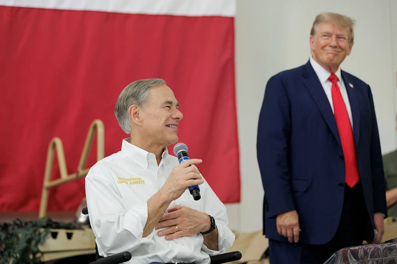 Former President Trump Visits The Southern Border With Texas Governor Abbott
EDINBURG, TEXAS - NOVEMBER 19: Texas Governor Greg Abbott gives remarks with Former President Donald Trump at the South Texas International airport on November 19, 2023 in Edinburg, Texas. Trump and Abbott served meals to Texas National Guard and Texas DPS Troopers that are stationed at the U.S.-Mexico border over the Thanksgiving holiday. (Photo by Michael Gonzalez/Getty Images)