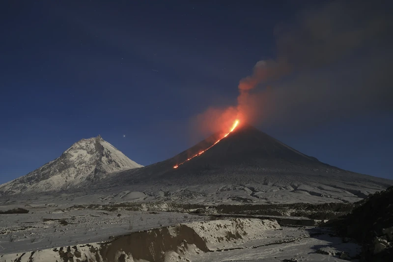The Klyuchevskoy volcano, one of the highest active volcanoes in the world, erupts in Russia's northern Kamchatka Peninsula, Russian Far Eat, on Saturday, Oct. 28, 2023. Huge ash columns erupted from Eurasia's tallest active volcano on Wednesday, Nov. 1, 2023, forcing authorities to close schools in two towns in the region. (AP Photo/Yuri Demyanchuk)
